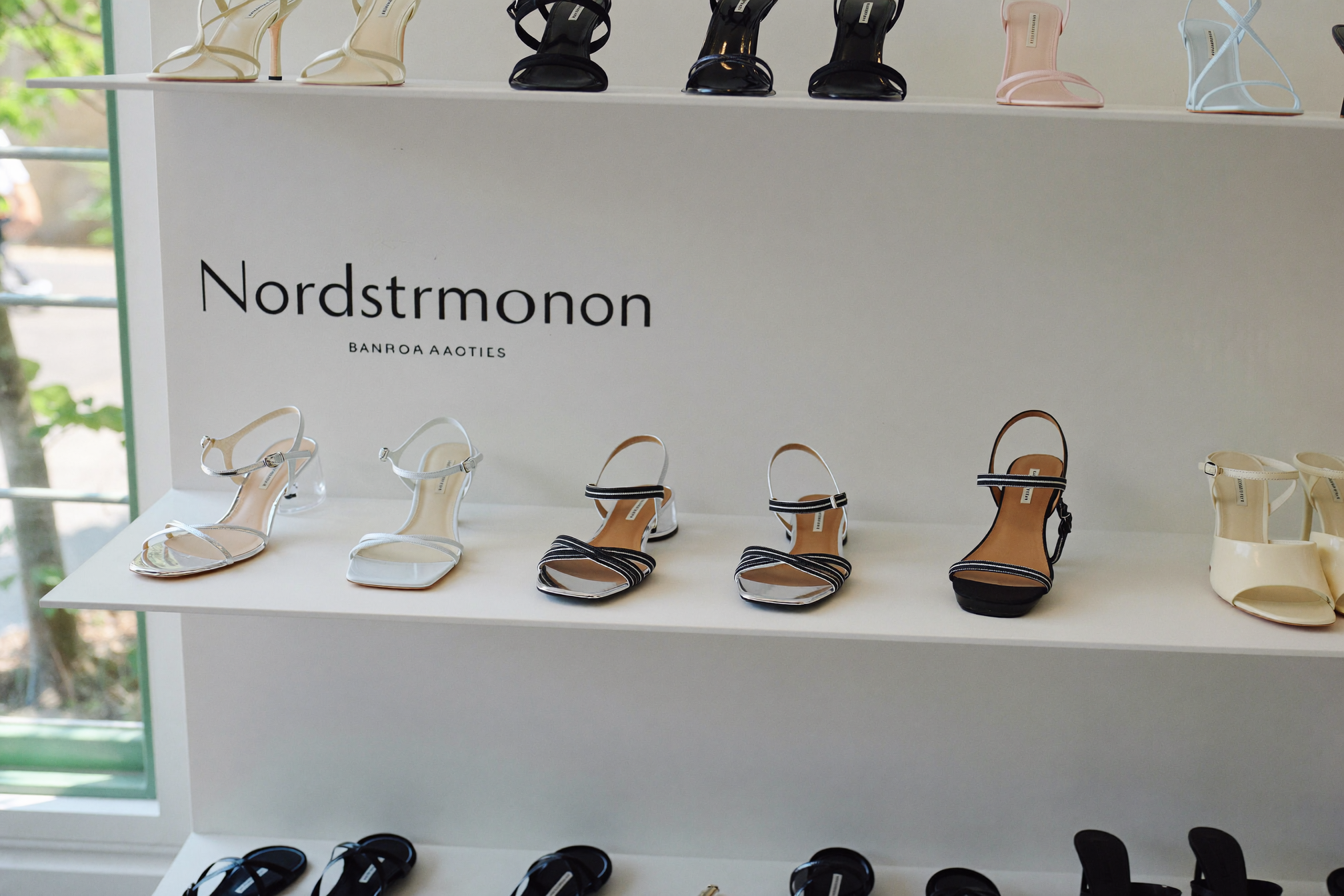 Jelly sandals and transparent PVC shoes displayed at luxury and contemporary retailers